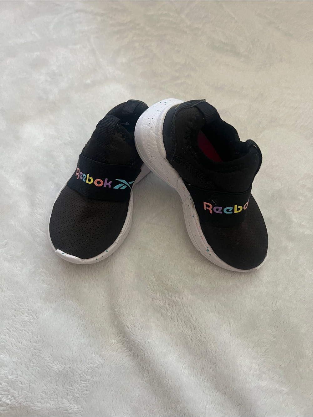 Reebok Kids Black Slip-On Sneakers with Rainbow Logo Accent